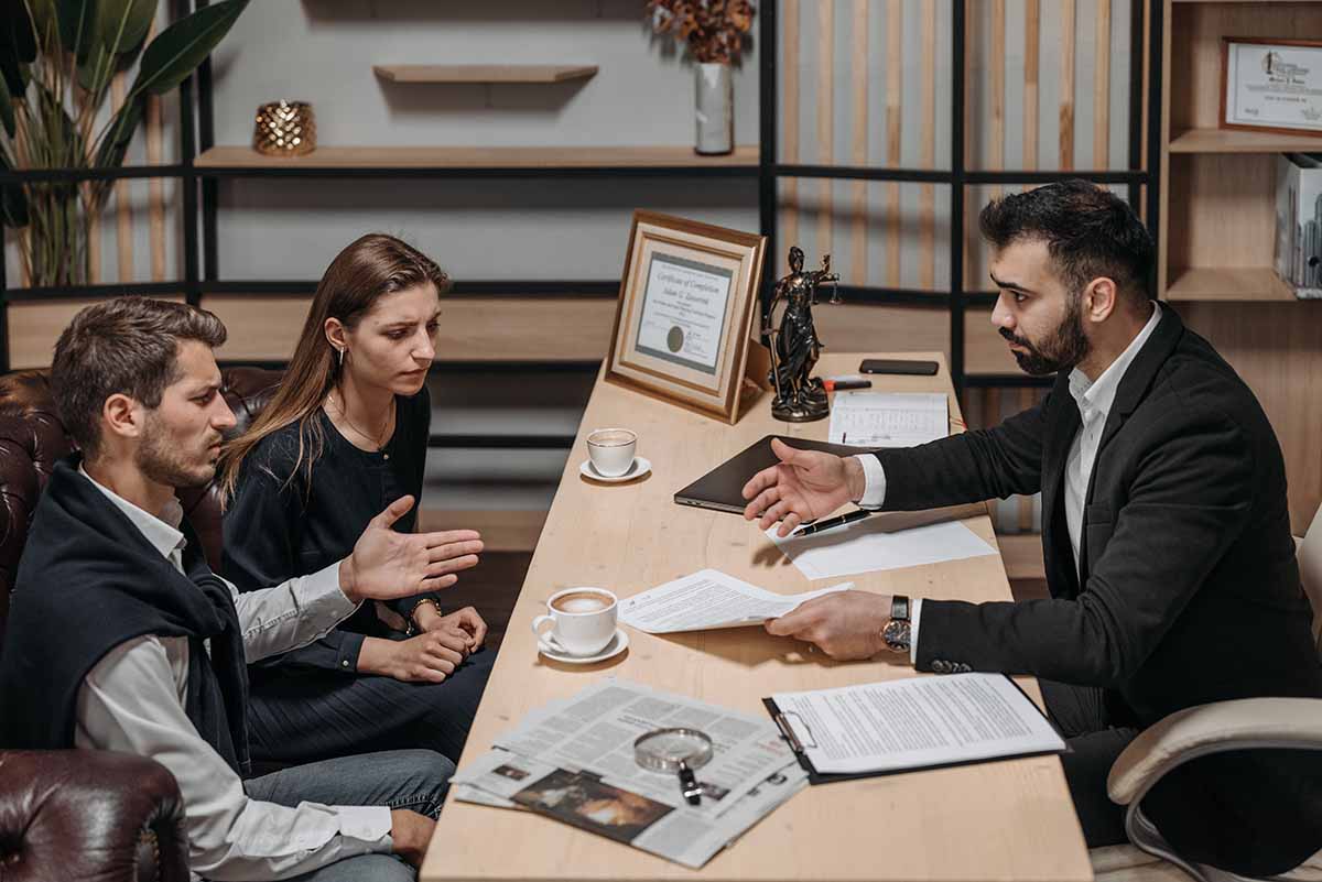 Couple Discussing Taxes at Lawyers Office