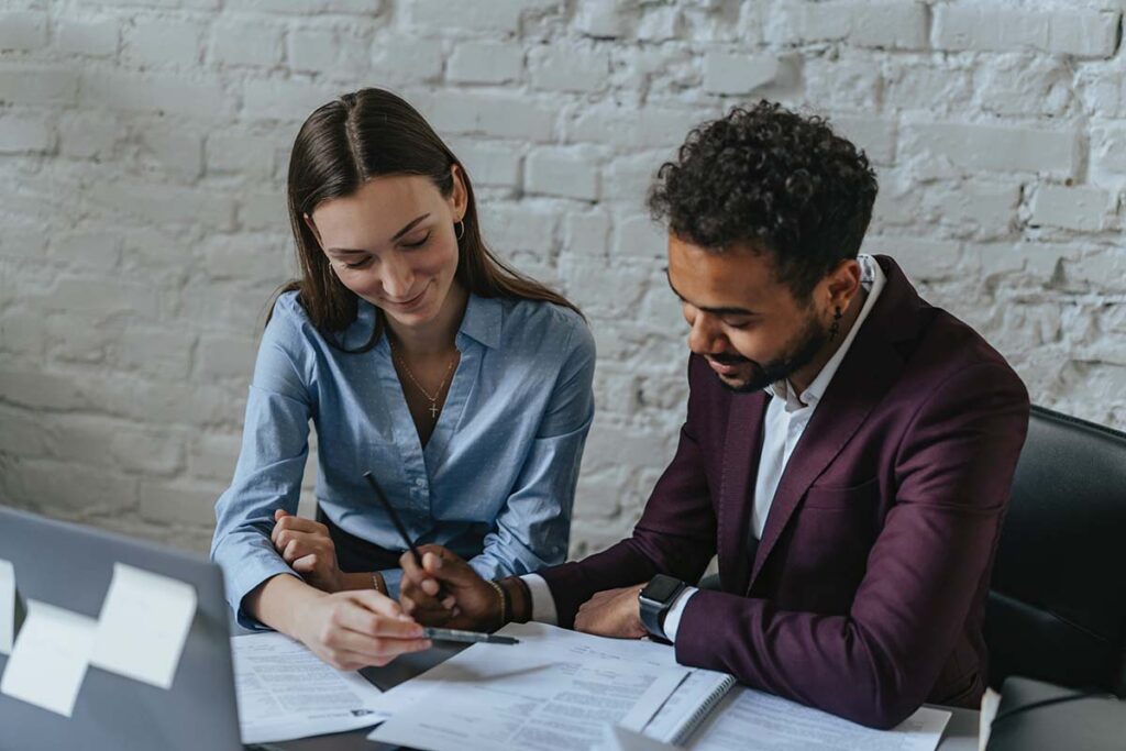 Female Lawyer Explaining Tax Paperwork to Client