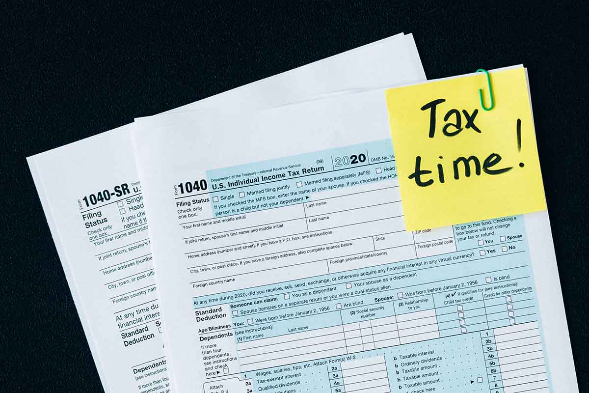 Tax Paperwork with Sticky Note that Says Tax Time