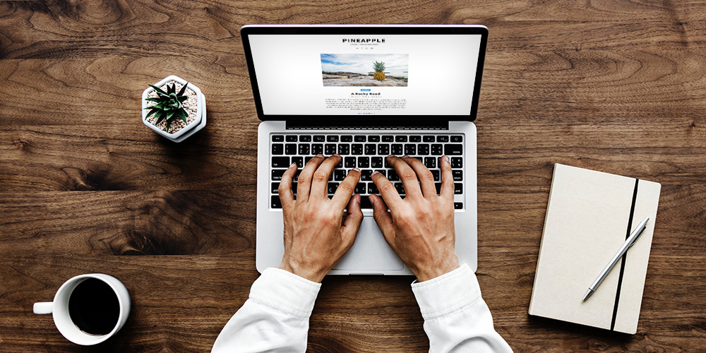 Man Working on Laptop at Home