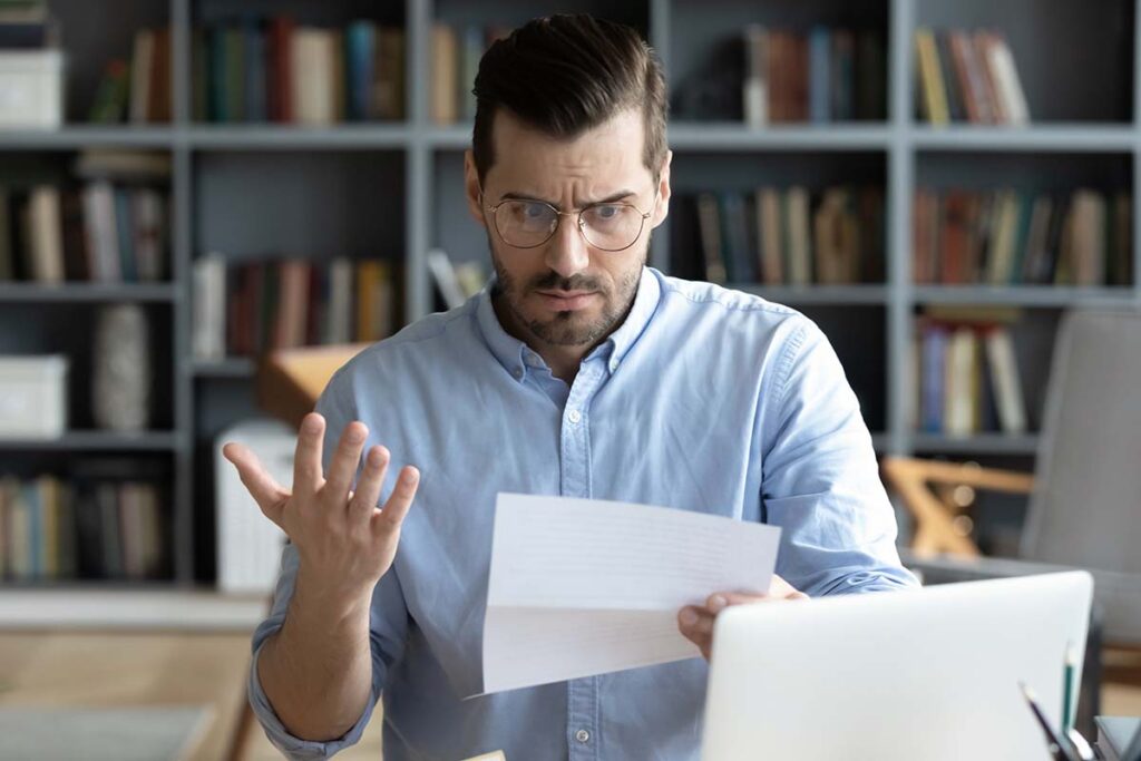 concerned man with a letter