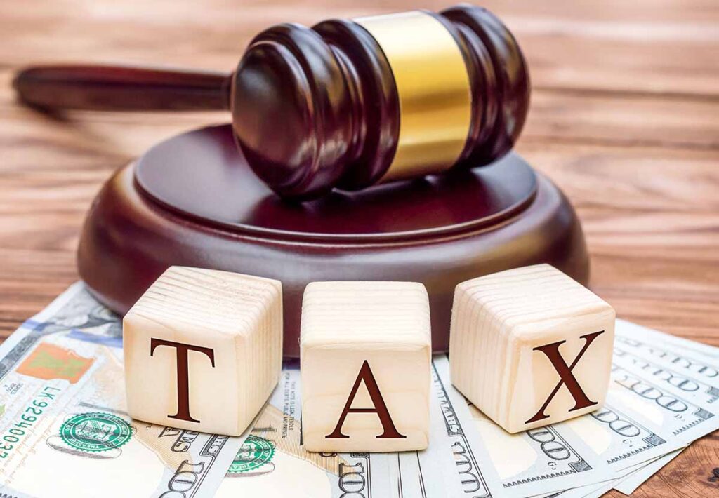 Gavel and Tax law blocks and cash