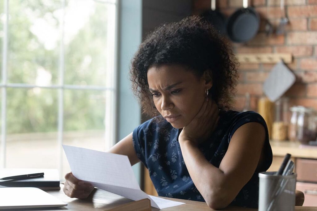 woman looking at a tax lien letter